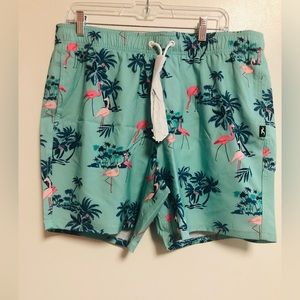 NWT Hollister men’s swim trunks size XL. Pink Flamingo’s  on blue trunks.